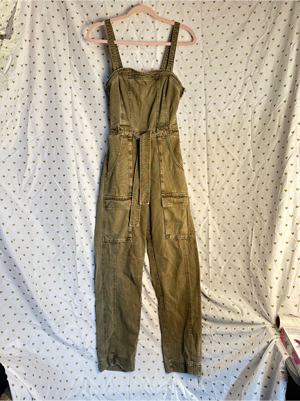 Free People Women’s Olive Green Utility Cargo Jumpsuit with cutout back accent.